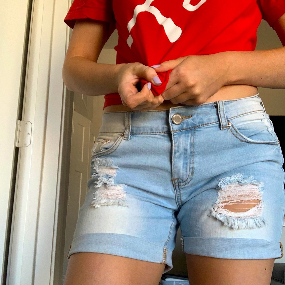 Distressed blue jean shorts, mini biker length